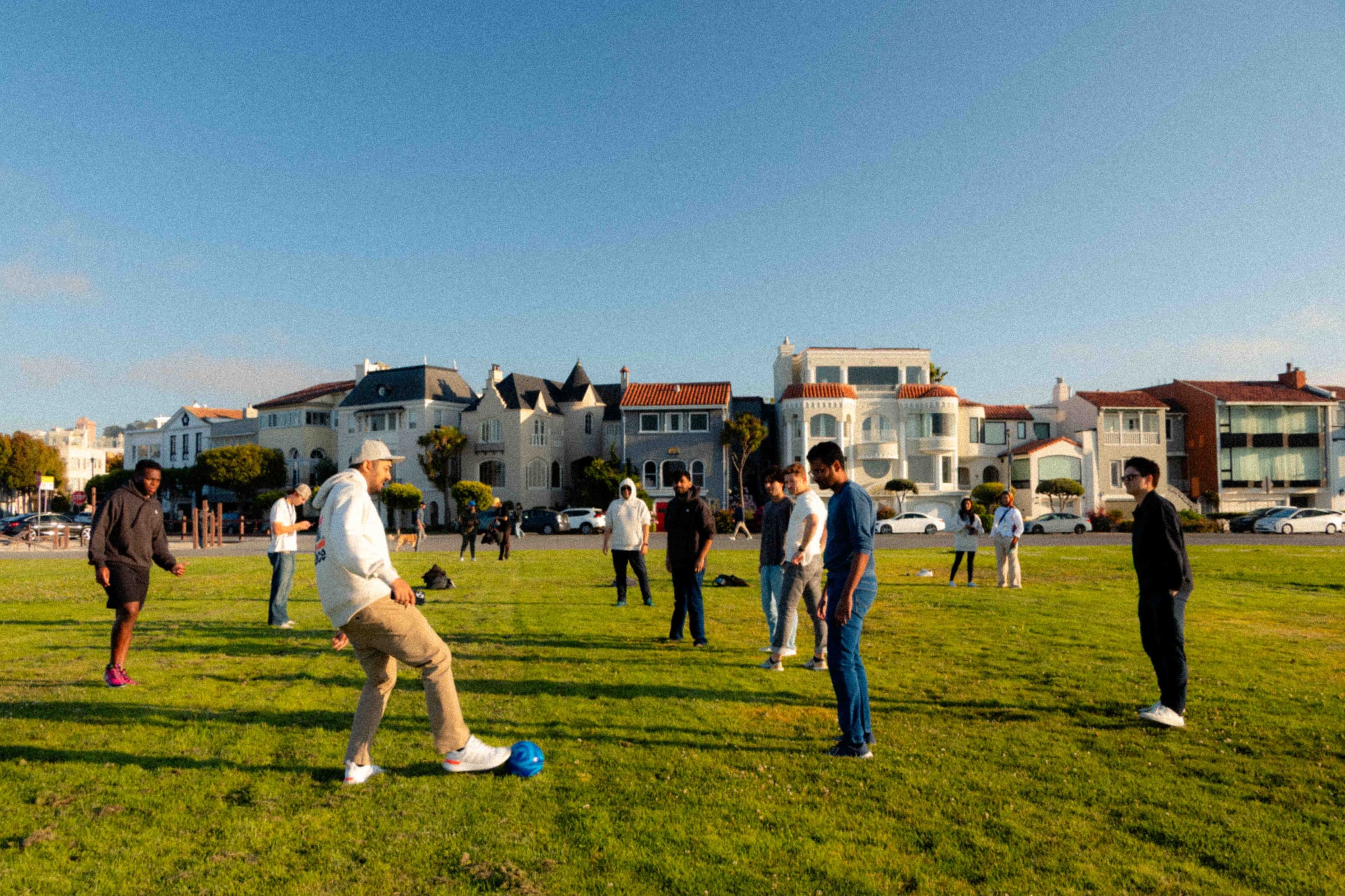 A group meeting for a casual game outdoors
